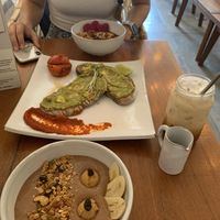 Chocolate smoothie bowl, açaí bowl, smashed avo, iced latte with cashew milk  at Vibe Cafe in Siem Reap
