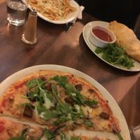 Blurry but seitan pizza, mushroom calzone and pizza fries  at Interval Bar in Sheffield