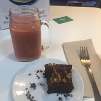 Kiwi, pineapple and strawberry smoothie and raw chocolate brownie! at Urban Orchard in Madrid