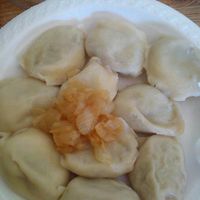 pierogi with lentils carrot and caremelized onions on top at Przystanek Pierogarnia - Rynek Debnicki in Krakow