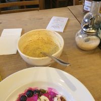 Coconut dragon fruit bowl and turmeric latte. at Le Pain Quotidien - Simon Stevinplein in Bruges