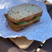 Breakfast sandwich with tofu “egg” patty. YUM at Bunkhouse Coffee Bar in Jensen Beach
