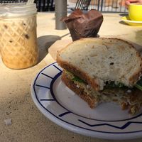 Lavender agave iced latte, chocolate banana muffin, tofu breakfast sandwich  at Bunkhouse Coffee Bar in Jensen Beach