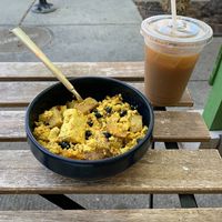 Tofu breakfast burrito bowl and iced coffee!  at Fancy Plants Cafe in Chicago