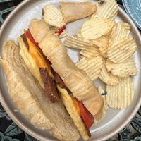 Croissant sandwich and chips   at Fancy Plants Cafe in Chicago