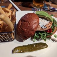 Grilled Gardein Chicken sandwich with vegan mozz, avocado, sundried tomatoes and arugula. at Yard House in Seattle