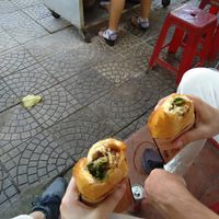 One bite gone at Hoi Banh My Chay - Food Stall in Hoi An