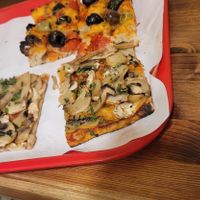 Olive pizza and funghi pizza at Pizza Dai Cinque in Rome