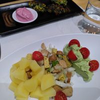 Appetizers of the daily menu. German salad with sausage and spinach croquettes at La Huella Vegana in Alcala De Henares