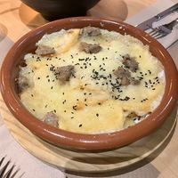 Patatas tres quesos gratinadas  at La Huella Vegana in Alcala De Henares