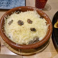 Patatas tres quesos at La Huella Vegana in Alcala De Henares