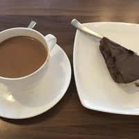 vegan massala tea and chocolate cake  at Nick's Italian Kitchen in Dharamshala