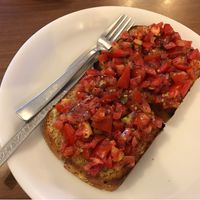 tomato garlic basil bruschetta in homemade brown bread 😍 super yum! (ask them for olive oil to make it vegan) at Nick's Italian Kitchen in Dharamshala