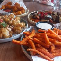 Sweet potato fries, cauliflower, roasted vegetables and tater tots. at Happy Bar & Grill in Ruse