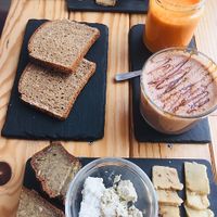 Amazing vegan cheese board with juice and 'Snickers' milkshake! at Foodprintz Cafe in Lisbon