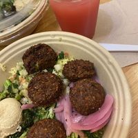 Bowl- rice, quinoa, broccoli, falafel, hummus, onions, & cucumber! Watermelon lime Fresca to drink.   at ANZO in Boynton Beach