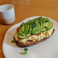 Avo and scrambled tofu on toast at Raw Nest in Krakow