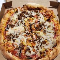 Red sauce, veggies on the bottom, vegan sausage crumble and vegan cheese 👌 at Mod Pizza - 6th Ave in Seattle