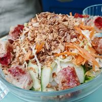Homemade brioche bread, mint and celery leaves, coleslaw, roasted eggplant, tomato and dill, served with fries. at Primeur Cantine in Paris