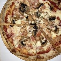 Vegan chicken pizza (with real cheese but vegan cheese available)  at Veggie House in Astana