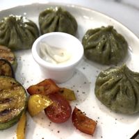 Spinach tofu momos w grilled veggies  at Veggie House in Astana