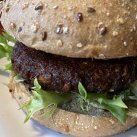My Sunshine burger-  sweet potato, kale & wild-rice patty, avocado, baby kale, organic tomato, spicy green goddess  at Bareburger - Hell's Kitchen in New York City