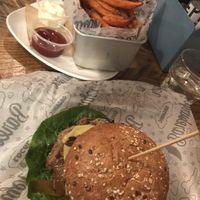 Impossible burger with vegan cheese, sweet potato fries with vegan mayo at Bareburger - Hell's Kitchen in New York City