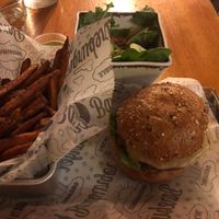 Sweet potato fries, side salad, Beyond burger on multigrain bun at Bareburger - Hell's Kitchen in New York City