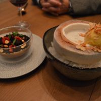 Chocolate terrarium with peanut butter cream, and coconut chia pudding with passion fruit sorbet (served inside a young Thai coconut).  at PLANTA - Yorkville in Toronto