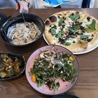 Udon noodles (top left); leek Bianca pizza (top right); bang bang broccoli (bottom left); fungi salad (bottom right)  at PLANTA - Yorkville in Toronto