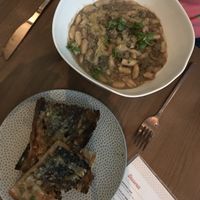 Mushroom bolognese and lemony garlic bread at PLANTA - Yorkville in Toronto