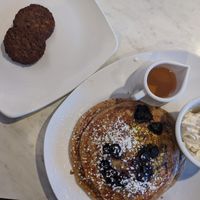 Oat milk protein pancakes and side of vegan sausage at Silver Diner in Frederick