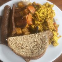 Breakfast platter w/vegan sausage, seitan bacon, tofu scramble. Vegan butter   at Subia's Organic Cafe and Market in Jersey City