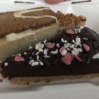 Biscoff cheesecake and chocolate cake. Sooooo awesome. Its rare that the cake is that extraordinary good. Full taste. And the takeaway box was made of recyclable materials. at Rabbit Vegan Cafe in Exeter