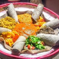 Injera with different kinds of wat.  at Tzlal in Beer Sheva