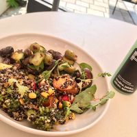 Salad with plums, cold press juice at Fach Juice Shop in Bratislava