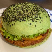 Jungle BBQ, with oat and red beans burger, tomatoes, salad, courgettes, vegan cheddar, bbq and wild sauces  at Flower Burger in Rome