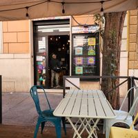 Seating area in front of restaurant at Flower Burger in Rome