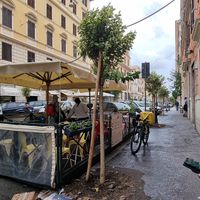 Outdoor seating at Flower Burger in Rome