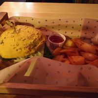 Cheesy Cecio burger with wedges at Flower Burger in Rome