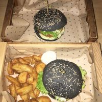 two different burgers. One as a menu with potatoes at Flower Burger in Rome