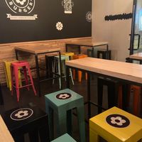 The decor is adorable and very Mary Quant  at Flower Burger in Rome