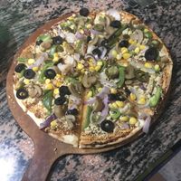 Vegan pizza (cashew crumble cheese) at Yummy Yoga Cafe in Udaipur
