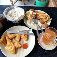 Tofu Pakora (front), Hummus plate with Falafel , Ginger Kombucha at TATTV Cafe in Rishikesh