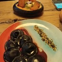 Mains: black shitake ravioli (front) and broccoli Gnocchi with tomato sauce and potato slices (back). at Hearth  in Amsterdam