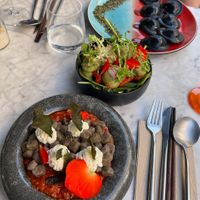 Buckwheat lentil gnocci, black charcoal ravioli & mixed salad at Hearth  in Amsterdam