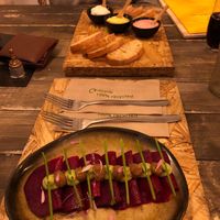 Rawvioli (beetroot) breads and dips in the background  at Hearth  in Amsterdam