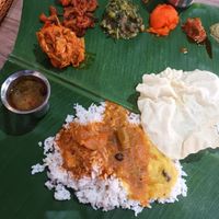Banana leaf rice set with papadom and rasem by the side too at Bindhu Restaurant in Subang Jaya