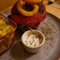 Beetroot bread burger (burger made of black beans and lentils) with veggie mayonnaise at Outro Lado in Faro