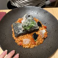 Fishy tofu with tomato ricee  at Outro Lado in Faro